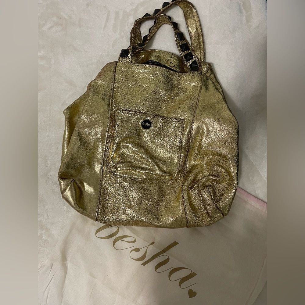 Gold Besha Brand purse